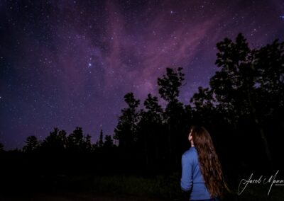 girl looking up at Milky Way