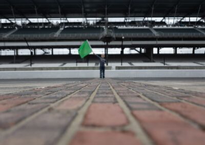 Indianapolis Motor Speedway Yard of Bricks with child holding Green flag